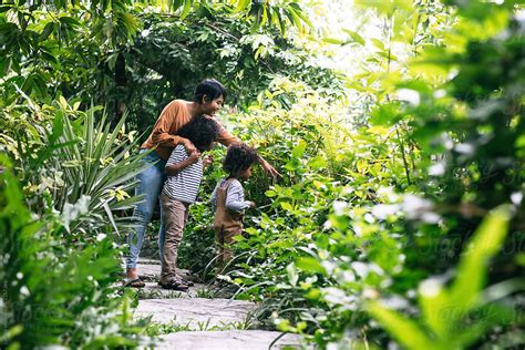 Mother And Children Exploring Nature By Stocksy Contributor Lumina