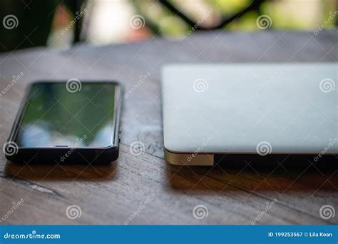 Laptop and Mobile Phone on Table Stock Image - Image of online, freelance: 199253567