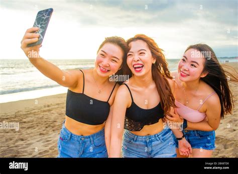 Lifestyle Beach Portrait Of Asian Korean And Chinese Women Group Of