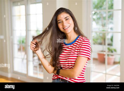 Beautiful Brunette Woman Smiling Cheerful Looking Happy And Positive Stock Photo Alamy