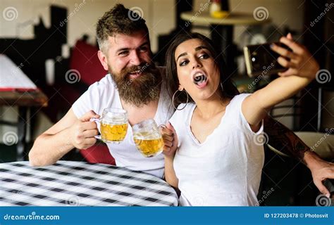 Couple Cheerful Mood Drinking Beer In Pub Man Bearded Hipster And Girl