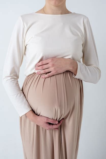 Premium Photo Portrait Of Elegant Young Pregnant Woman In Beige Dress