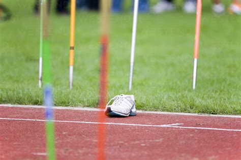 Javelins And Shoe In A Track And Field Stadium Stock Photo