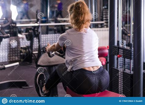 Fitness Caucasian Women Performing Doing Exercises Training With Rowing