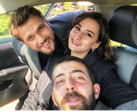 Three People Are Sitting In The Back Seat Of A Car Smiling At The Camera