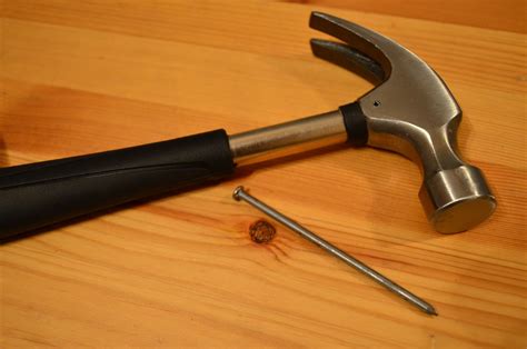 how to put nail in wall