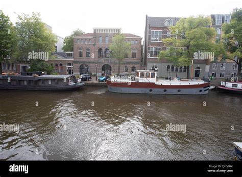 Amsterdam canal boat Stock Photo - Alamy