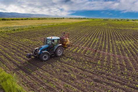 Premium Photo | Drone shot of farming tractor