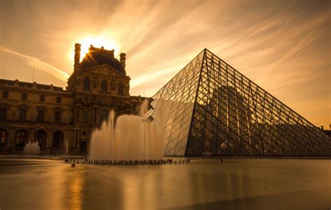 The new Lourve pyramid stands in front of the stunning Lourve Palace ...