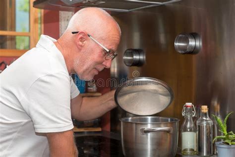 Mature Handsome Man Cooking In Home Kitchen Stock Image Image Of Male