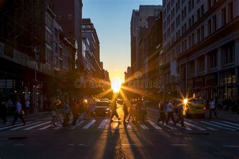 Diverse Crowd Of People Walking Across The Busy Intersection In New