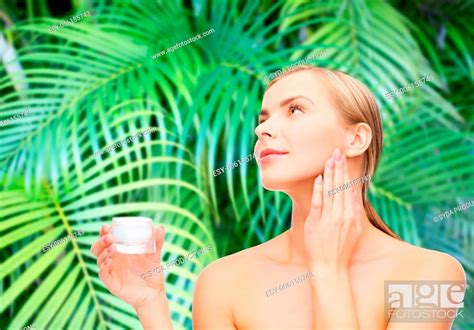 Cosmetics Health And Beauty Concept Beautiful Woman Applying Cream