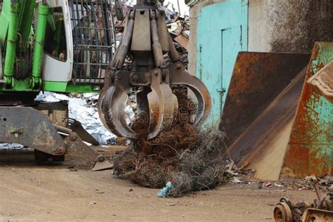 Jaw Crane Picking Up Scrap Metal For Loading Stock Image Image Of