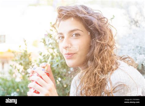 Modern Woman Drinking Coke Stock Photo Alamy