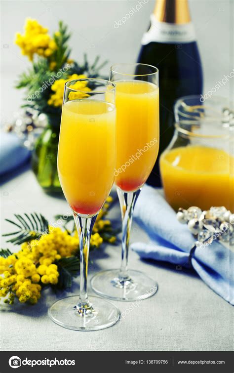 Two glasses with mimosa cocktail (cave plus orange juice) — Stock Photo © nschatzi #138709756