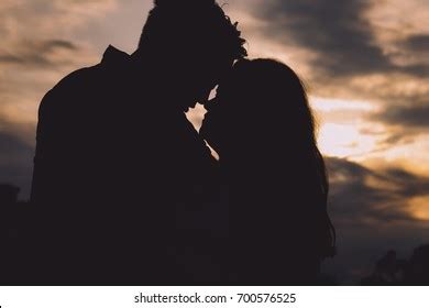 Romantic Couple Touching Foreheads Silhouette During Stock Photo