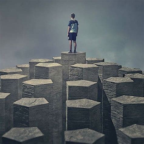 A Man Standing On Top Of A Large Group Of Blocks In The Air With Dark