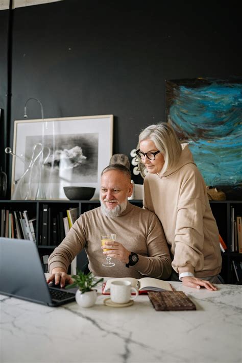 Man And Woman Sitting At Table · Free Stock Photo