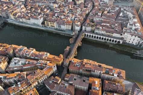 Aerial View Of Ponte Vecchio Crossing Arno River During Sunrise