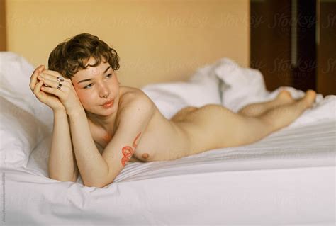 Happy Naked Transgender Person On The Bed By Stocksy Contributor