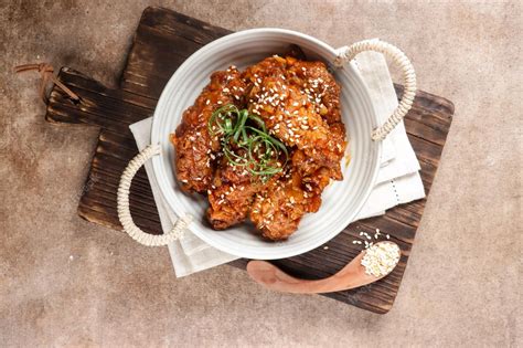 Premium Photo Korean Fried Chicken Yangnyeom Tongdak With Spicy Sauce And Sesame Seed Sayap