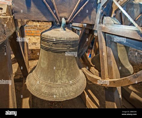 Traditional Large Old Bells Hanging In An English Church Tower From The