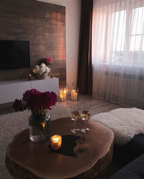 A Living Room Filled With Furniture And Candles