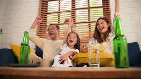 Happy Family Watching Sports Match Together on Television Stock Video ...