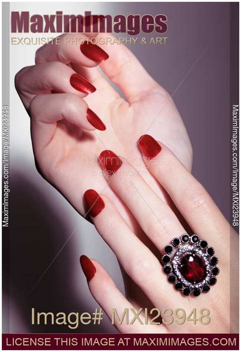 Stock Photo Woman Hands With Red Nail Polish And A Ring MaximImages