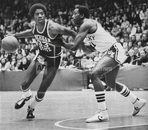 Michigan State forward Earvin Johnson (33) pushes off Kentucky forward Jack Givens as he drives ...