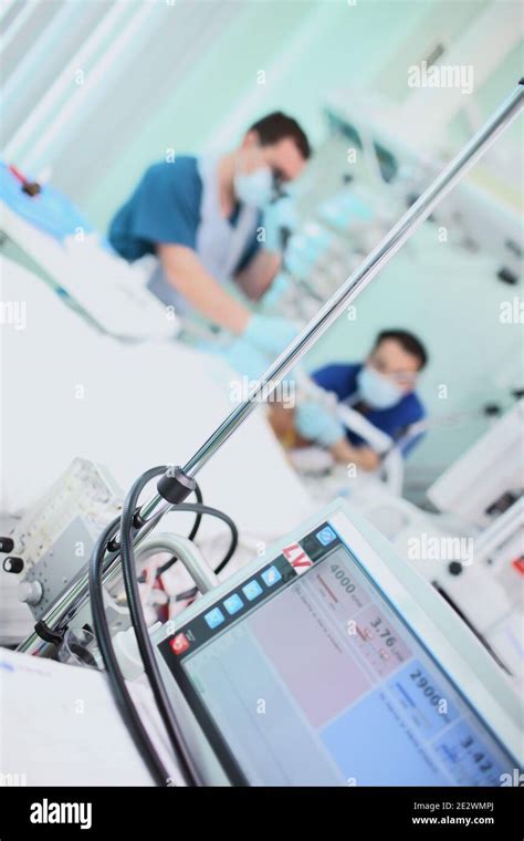 Working Doctors In The ICU Stock Photo Alamy