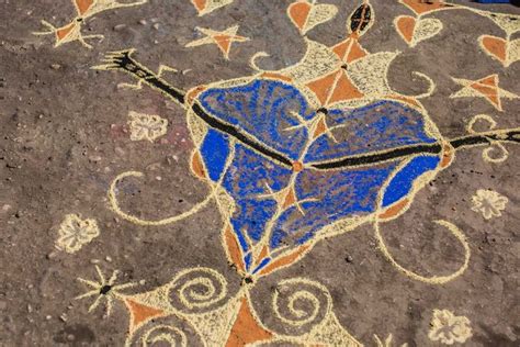 An Artistic Design On The Ground With Blue And Orange Hearts Painted On