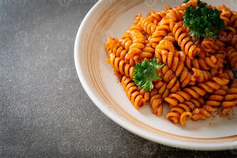 spirali or spiral pasta with tomato sauce 6165559 Stock Photo at Vecteezy