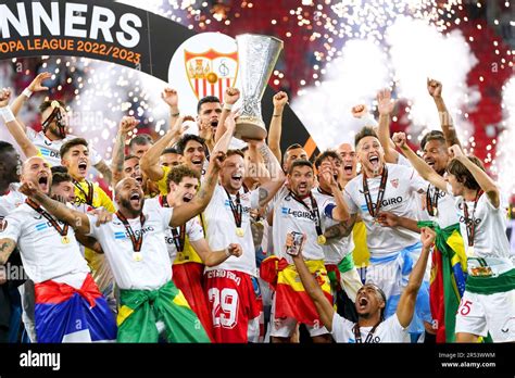 Sevilla players celebrate with the UEFA Europa League trophy after winning the UEFA Europa ...