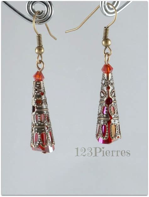 Boucles D Oreilles Exotiques Cristal Iris Rouge Dans Dentelle Cisel E