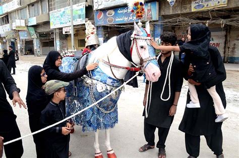 Mourners Touch Tazia During The Main Procession Of Th Muharram Ul