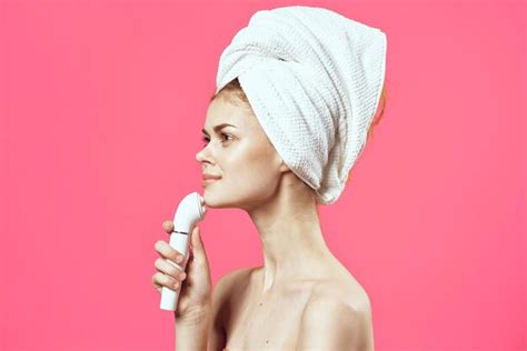 Premium Photo Woman With Towel On Head Naked Shoulders Massager