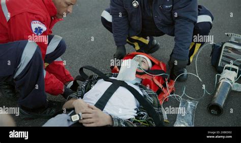 Healthcare Paramedic And Help Patient In Street On Scene For Emergency