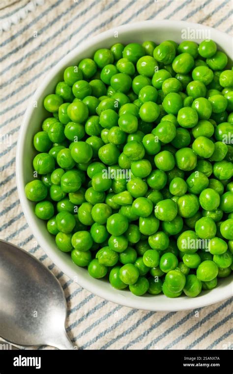 organic steamed frozen green peas   bowl stock photo alamy