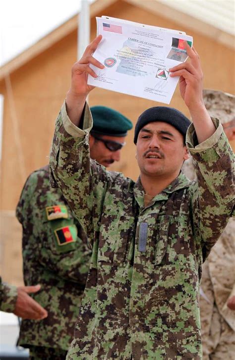 An Afghan National Army Soldier Proudly Shows His Graduation Nara