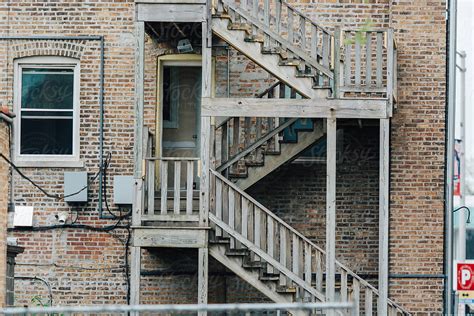 "Wooden Fire Escape Stairs Outside Of An Apartment Building" by Stocksy ...