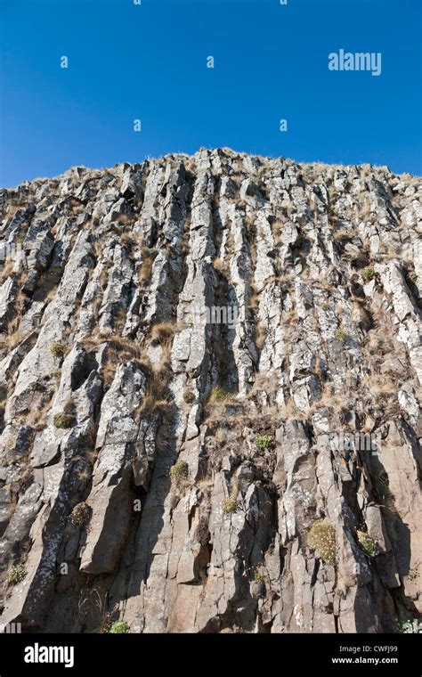 Looking up at a very steep cliff Stock Photo - Alamy