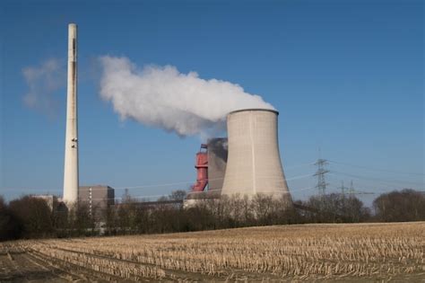 Premium Photo Smoke Emitting From Chimney Against Clear Sky