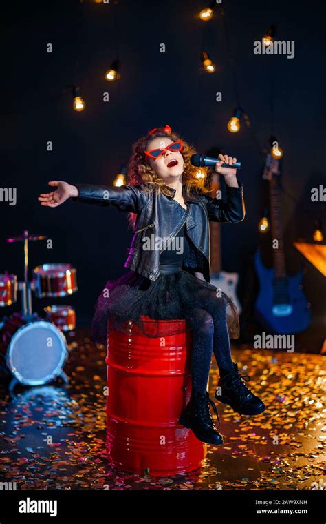 Beautiful Girl With Curly Hair Wearing Leather Jacket Red Sunglasses