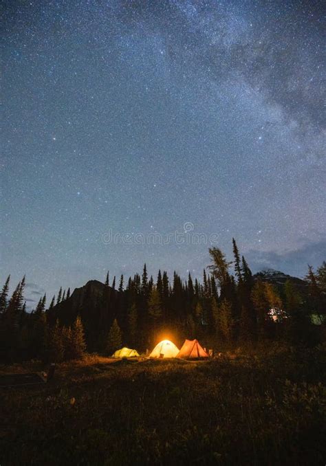 Camping Tents With Milky Way In The Night Sky On Campsite In Autumn