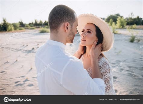 Beautiful Young Couple Hugging Beach — Stock Photo © DenKostiukBO #199941148