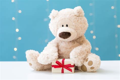 Teddy bear and gift box stock image. Image of blue, shining - 125929997