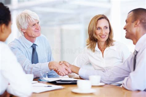 Business Deal. Portrait of Senior Executive Shaking Hands with Young ...