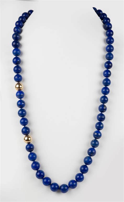 Lot 14K YELLOW GOLD AND LAPIS BEAD NECKLACE AND 18K YELLOW GOLD AND