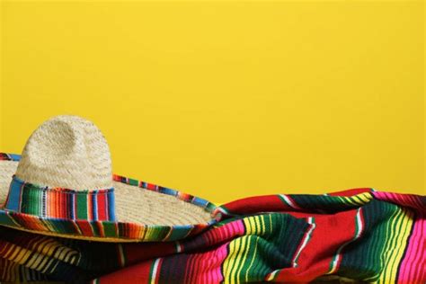 A Woven Mexican Sombrero Or Hat With A Colorful Serape Blanket Stock